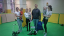 Экзоскелет на двоих: в Новосибирск привезли три тренажера, которые учат ходить детей вместе с родителями