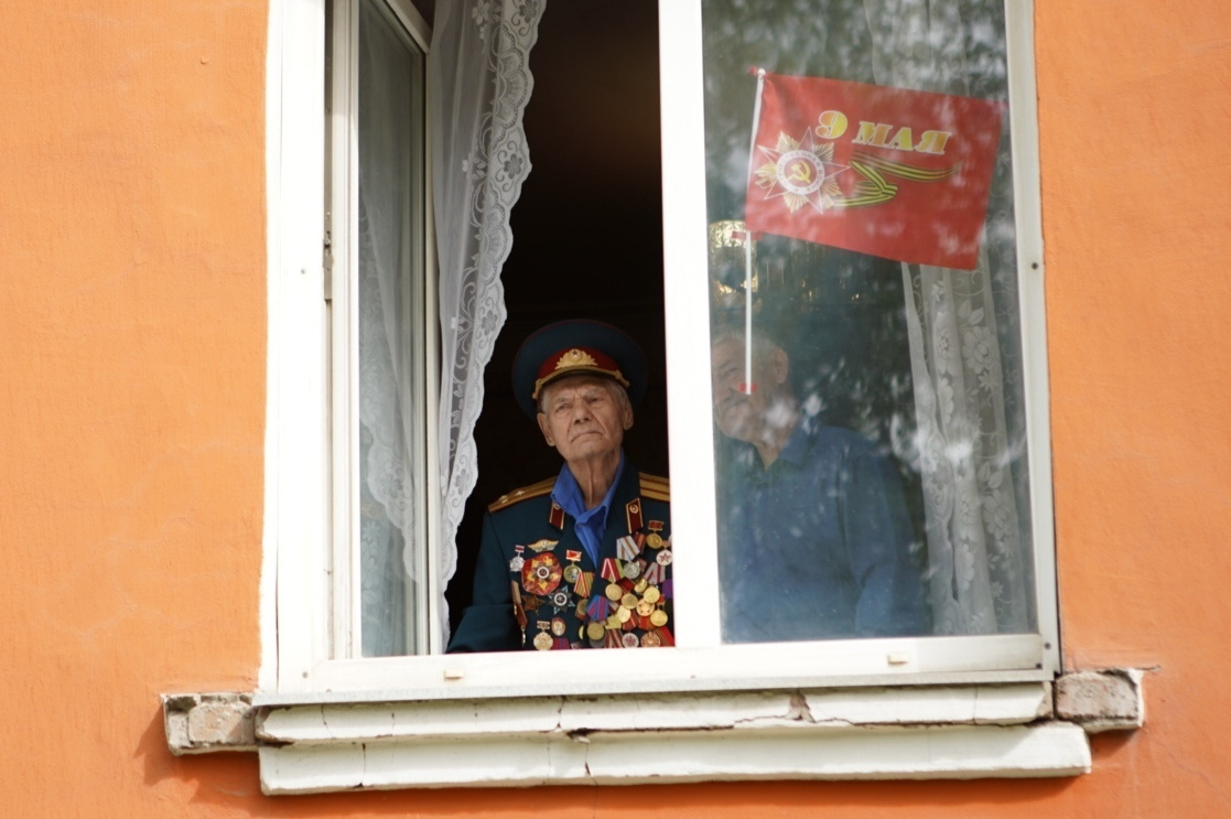 Василий Никифорович смотрит парад из своего окна 