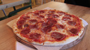 Владельцы сгоревшего бара «Шатун» открыли у Центрального парка кафе с гигантскими пиццами