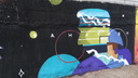 Котик с мячом и футбольные поля: уличные художники разрисовали здание на Большевистской