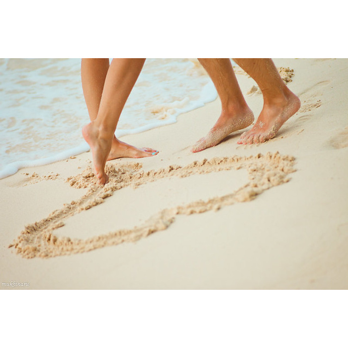 Traces of bare feet on the Sand. Traces of bare feet on the Sand of a Running man. Random Traces of bare feet on the Sand of a Running man.