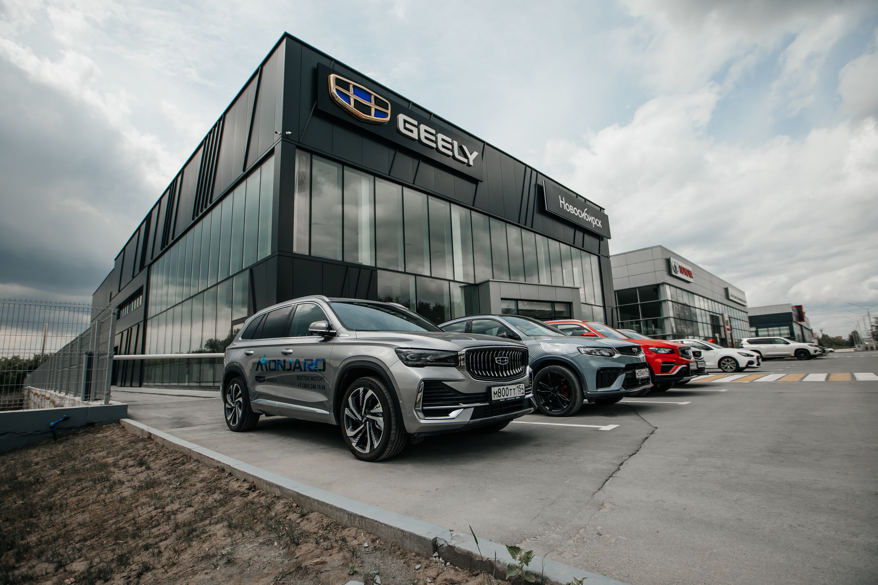 Восток моторс новосибирск. Geely Восток Моторс Большевистская улица. Geely Новосибирск. Магазин x Motors в Новосибирске. Восток Моторс фото Тюмень.