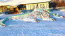 В Курганской области жители украсили дворы и участки снежными драконами